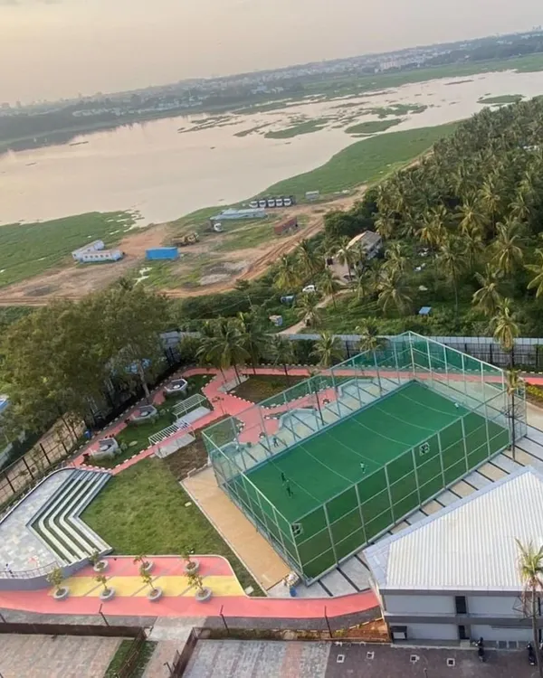 The completed multi-sport court and tiered amphitheater seating at Vaishnavi Tech Square. This active zone is designed to host everything from sporting events to community gatherings.