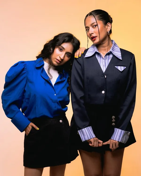 A studio shot for the Freakins x Myntra campaign, featuring clean, commercial makeup on two influencers. The look is fresh and youthful to align with the brand's target audience.