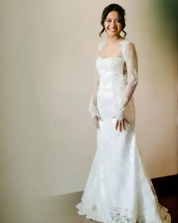 A beautiful full-length portrait of my Catholic bride in her stunning lace gown. The entire look, from the soft makeup to the classic updo, was designed to be timeless and elegant.