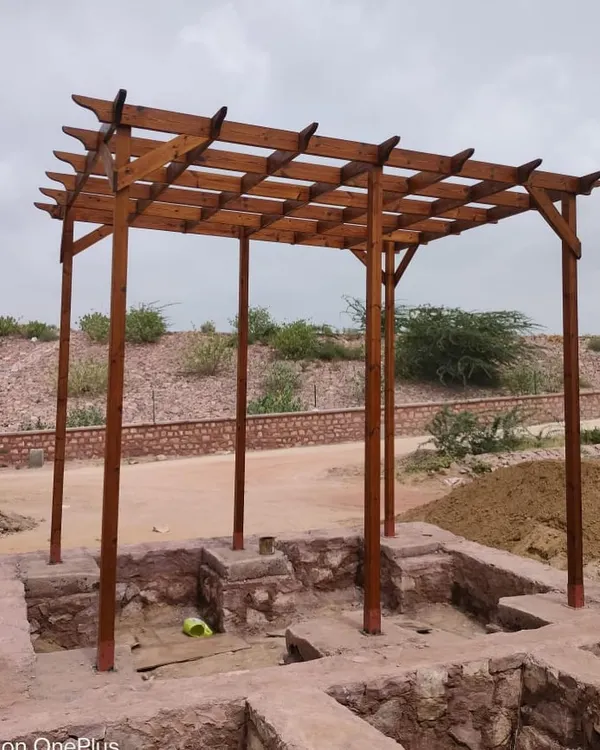 The completed Thermopine wood pergola at Surpura Dam, Jodhpur. Its simple, strong lines and warm wood tones complement the natural, rustic surroundings.