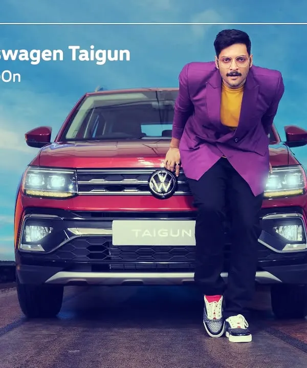 A commercial shoot for the Volkswagen Taigun featuring actor Ali Fazal. This shot combines the star power of the celebrity with the product, creating an aspirational image for the #HustleModeOn campaign.