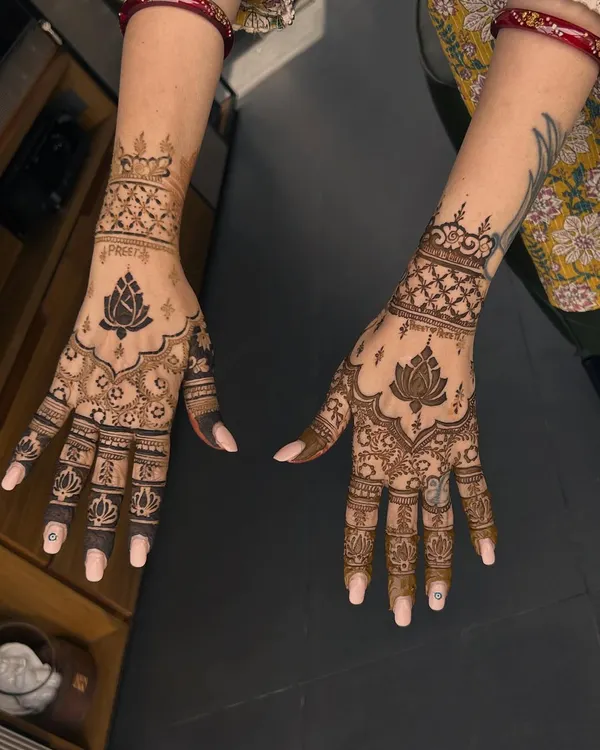 A beautiful semi-bridal design featuring a central lotus motif. The use of negative space makes the lotus the star of the show.