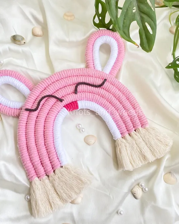 How sweet is this sleepy bunny rainbow? I love adding cute little details like ears to my macrame rainbows to give them extra personality. This piece is perfect for a soft, dreamy nursery theme.