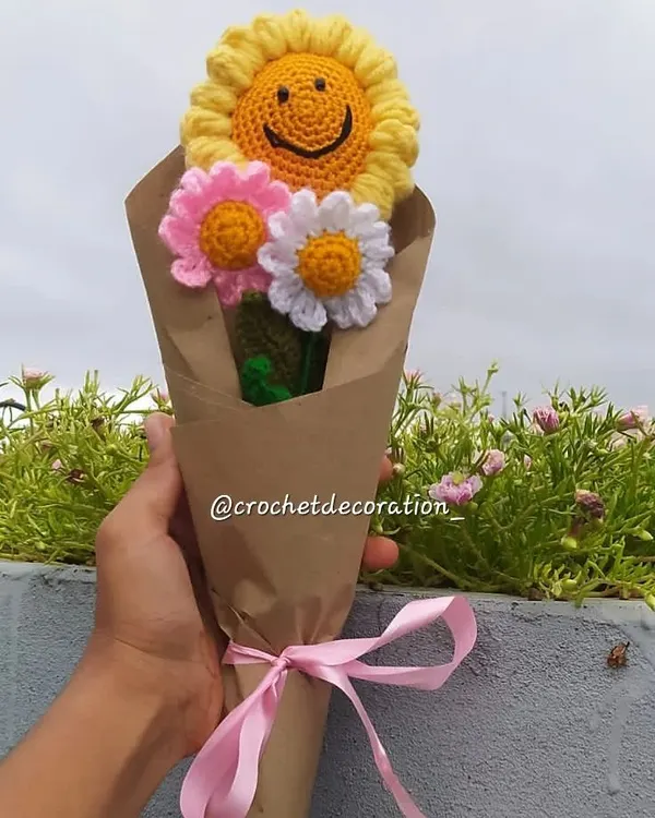 A beautiful custom bouquet wrapped and ready to be shipped. This one features a smiley sunflower and daisies, making for a cheerful and lasting gift.