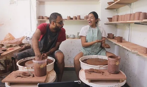 This is us, Mahanth and Shreya, in our happy place. We love the messy, joyful process of creating together, and this photo captures the fun we have bringing our ceramic ideas to life.