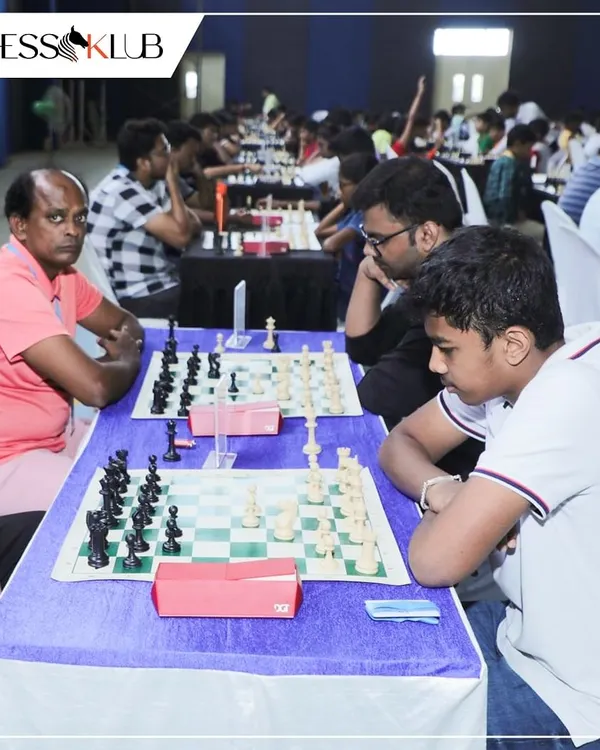 The focus is palpable during the Bengaluru Open Tournament. Players of different ages are seen here deep in concentration, planning their next moves in a competitive setting.