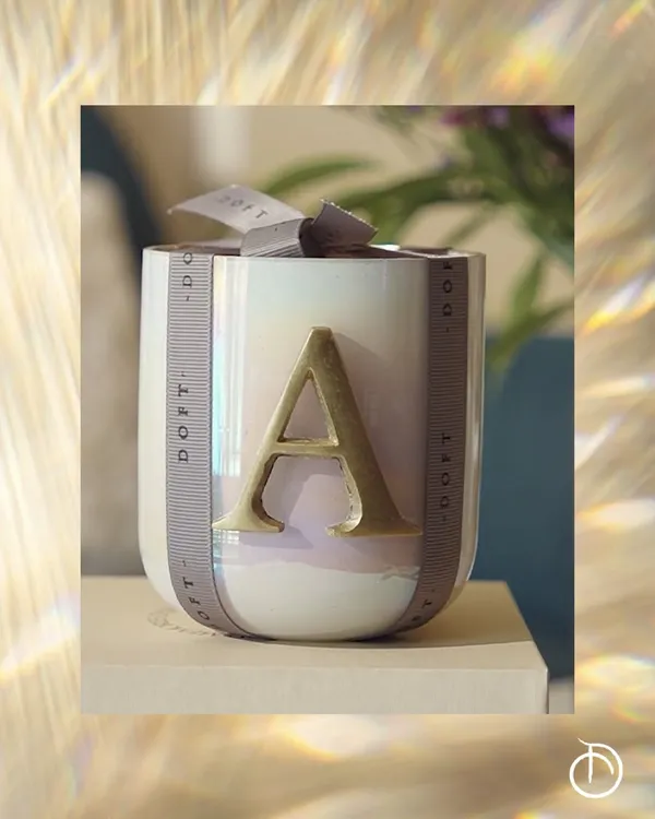 Every moment deserves a scent and a personal touch. My initial collection, featuring this iridescent candle with a gold 'A', makes for a thoughtful and elegant gift for your loved ones.