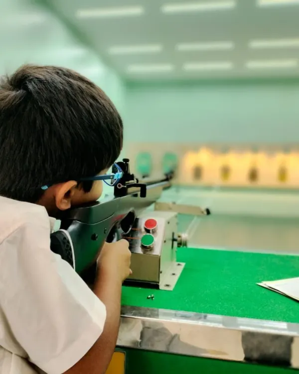 A young student from Greenwood Bannerghatta takes aim, demonstrating incredible focus. Our school programs emphasize proper technique and a steady mindset from an early age, laying the foundation for future champions.