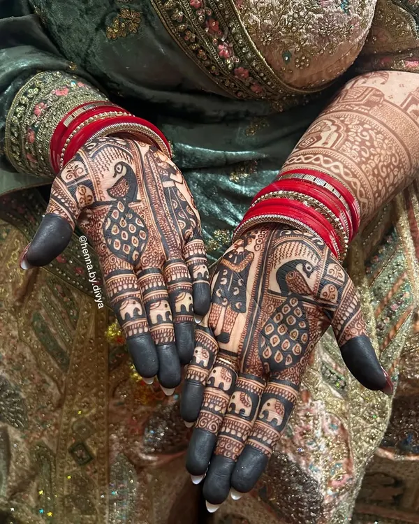 The result of natural henna and proper aftercare is this stunningly deep, blackish-maroon stain. The peacock and elephant motifs look incredibly bold and beautiful.