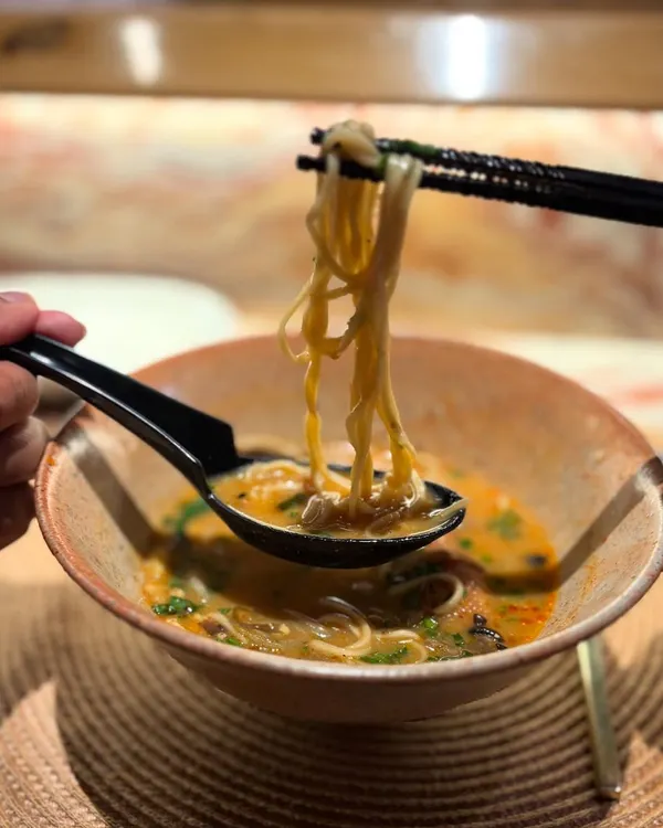 This is what it's all about for us. Seeing our handmade ramen bowl, crafted with care in our studio, being used to enjoy a delicious meal. This one features our popular Shino glaze.