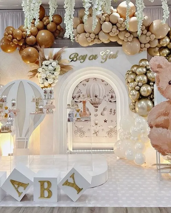 This grand teddy bear themed baby shower is one of my signature looks. The neutral palette with gold accents, extensive balloon arrangements, and custom 'BABY' blocks create a luxurious and welcoming atmosphere for a gender-neutral celebration.