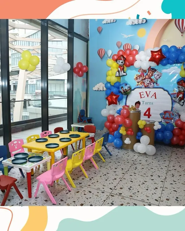 No job is too big, no pup is too small for our Paw Patrol themed party setup. We created this amazing backdrop with a balloon arch and character cutouts for Eva's 4th birthday, complete with colorful kid-sized tables ready for the little guests.