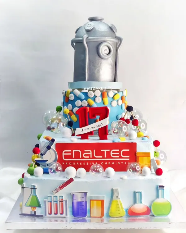 A massive, custom-themed cake for the 17th anniversary of a pharmaceutical company. This huge creation featured a rotating reactor on top and was full of edible scientific details.