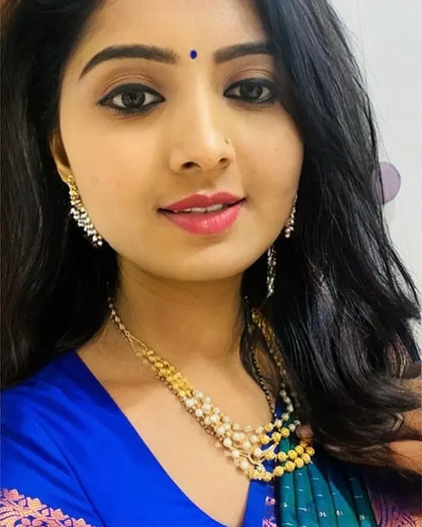 A beautiful example of a simple and elegant makeup look. The focus is on clean skin, defined eyes with kohl, and a natural lip color, making it perfect for a smaller function or a pre-wedding event.