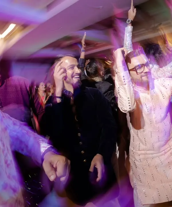 This is what a trippy sangeet looks like. I use slow shutter speeds and zoom bursts to create a motion blur effect that captures the wild energy of the dance floor.