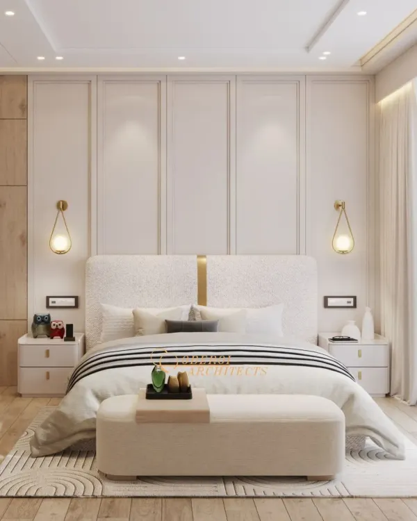A beautifully symmetric bedroom design centered around a textured headboard and elegant wall paneling. The teardrop pendant lights add a touch of modern artistry, while the neutral palette promotes tranquility.
