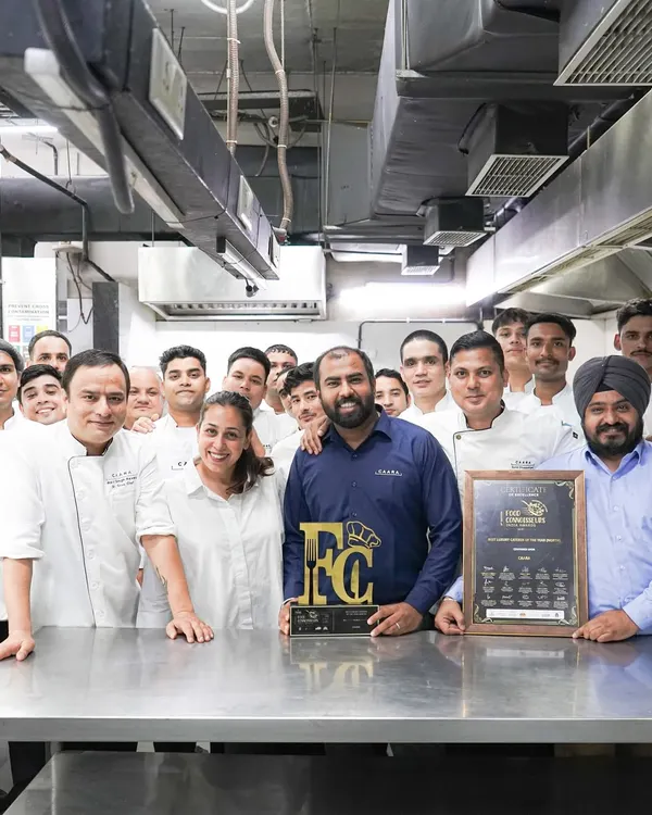 The entire CAARA team celebrating our "Best Luxury Caterer" award. This award is a testament to the hard work, dedication, and passion of every single member of our team.