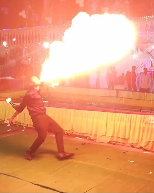 The ultimate showstopper. My fire-breathing act is a thrilling performance that adds a huge "wow" factor to any wedding or large-scale party, all performed with strict safety protocols.