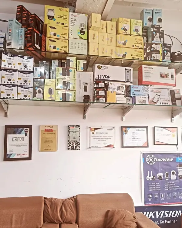 A view inside my new branch, with shelves fully stocked with the latest security products. You can also see some of my authorized partnership certificates on the wall, which are a testament to my commitment to quality.