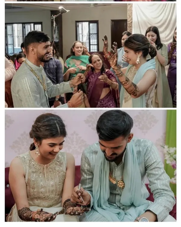 A candid moment from Harshita's mehendi ceremony, with the groom playfully applying henna. These are the fun memories that make a wedding special.
