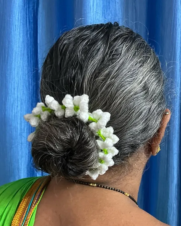 A close-up of the beautiful white crochet gajra I made for my Aaji. It looks so elegant in her hair bun, just like traditional jasmine flowers, but these will last forever.
