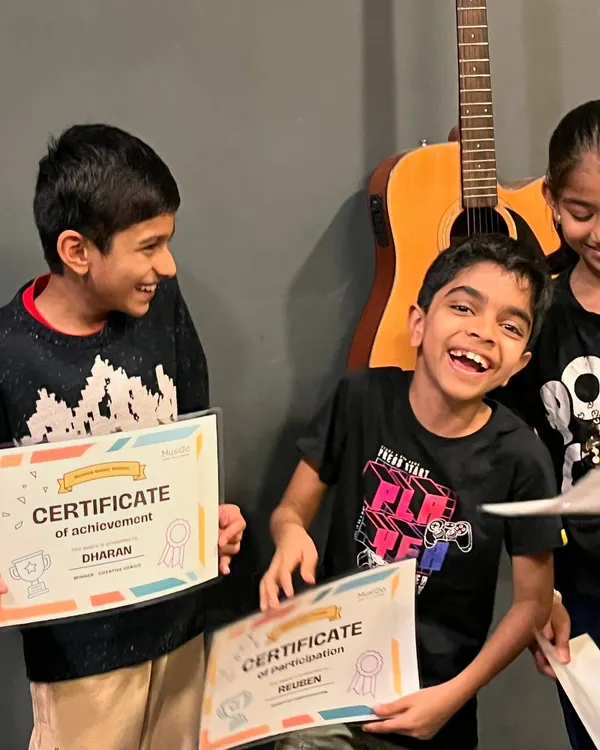 The pure joy of accomplishment! This is what our kids' music camps are all about: building skills, making friends, and celebrating every little victory with a huge smile and a certificate of achievement.