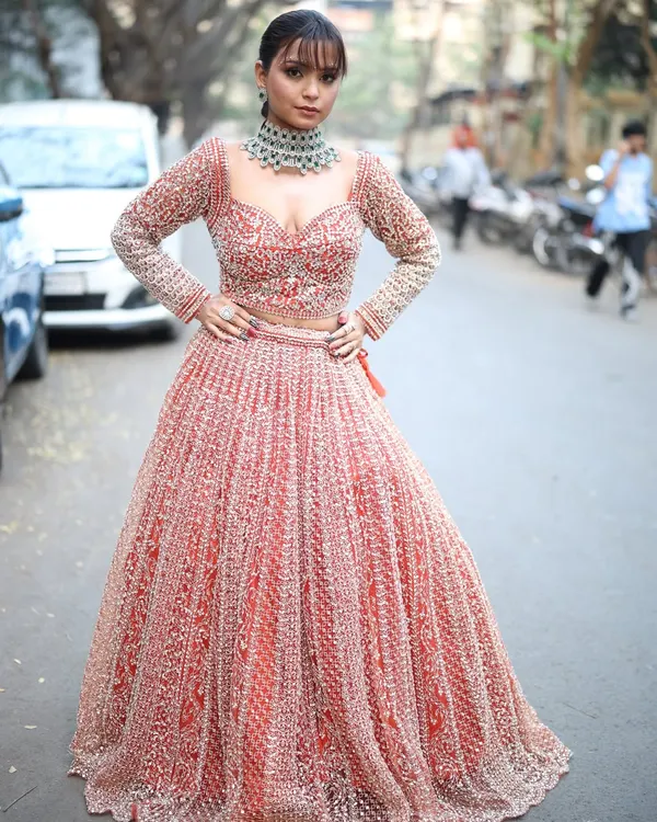 This stunning red and silver lehenga is one of my personal favorites. It's perfect for a bride's sangeet or a grand wedding reception, with heavy embroidery that sparkles from every angle.