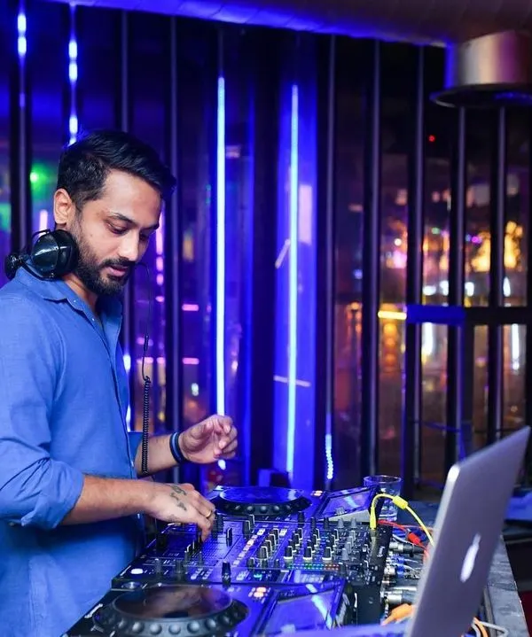 Focused on the mix during my Thursday night set at BOHO. I use industry-standard Pioneer DJ gear to ensure a high-quality, seamless musical journey for the audience.