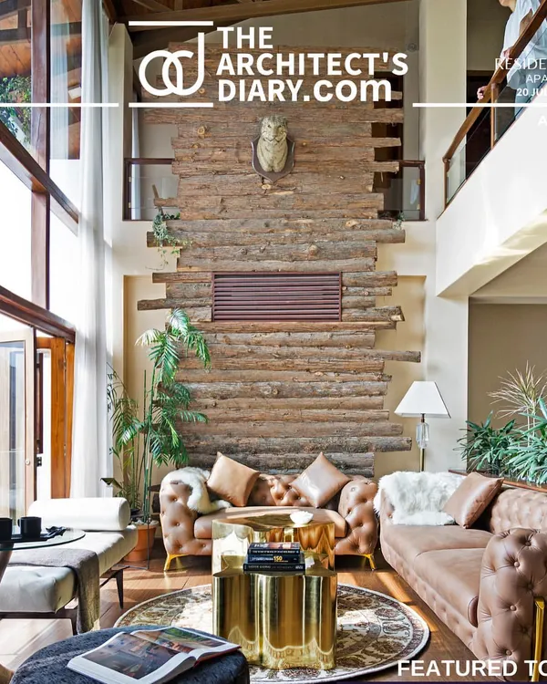 I was thrilled to see the 'Aangan' house featured in The Architect's Diary. This shot captures the double-height living room with its rustic log wall and expansive windows, showcasing the blend of cozy textures and open, light-filled design.