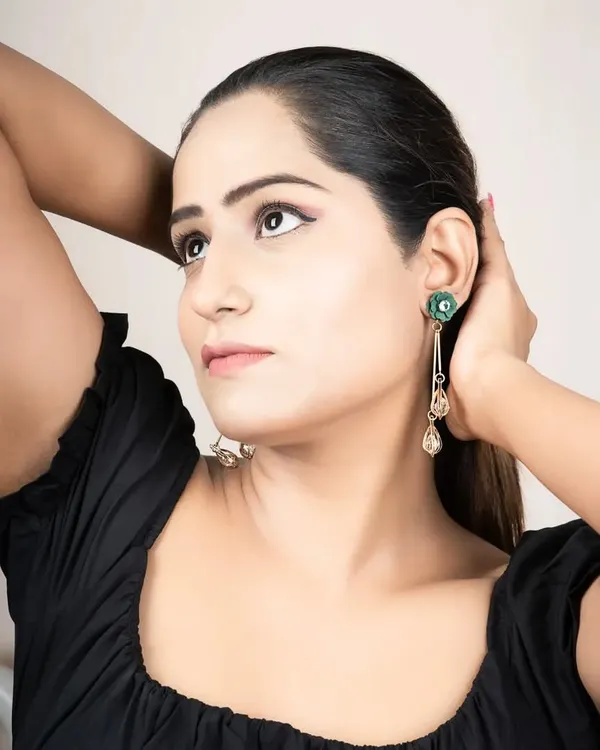 A lifestyle shot for a jewellery brand, showing how the earrings look when worn. This helps customers visualize the product in a real-life context.