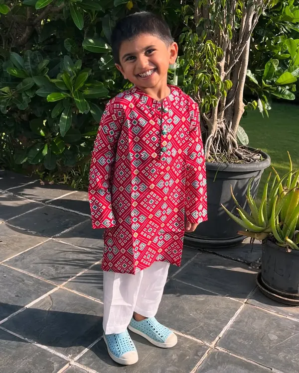 Dapper and full of joy. This striking red Patola print kurta is crafted from soft cotton, making it perfect for keeping your little guy active and carefree during any festival.