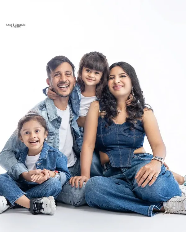 A picture of pure happiness! We had a super fun studio session with this adorable family, capturing their joyful energy in a classic denim-and-white theme.