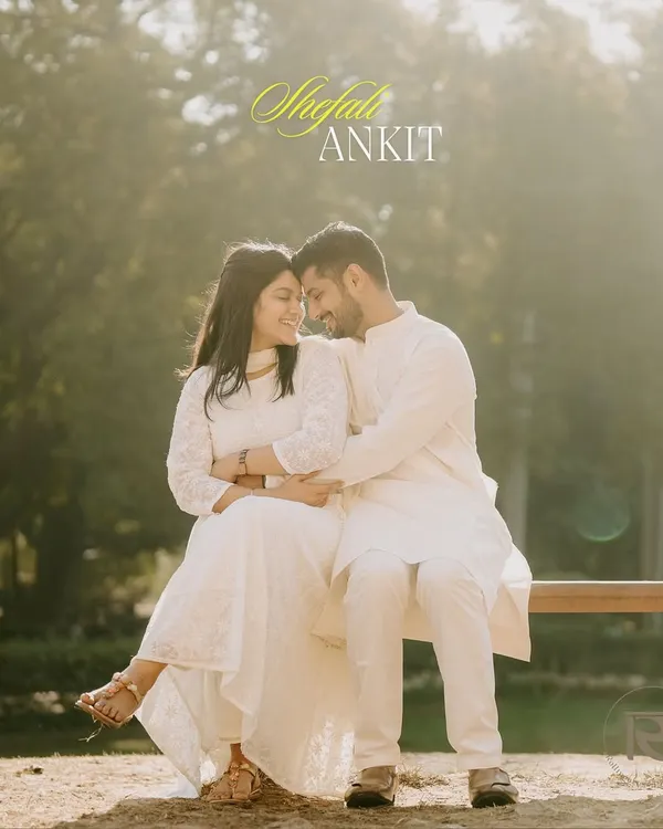 A soft and romantic portrait of a couple sharing an intimate moment on a park bench, bathed in the warm, golden light of the afternoon sun.