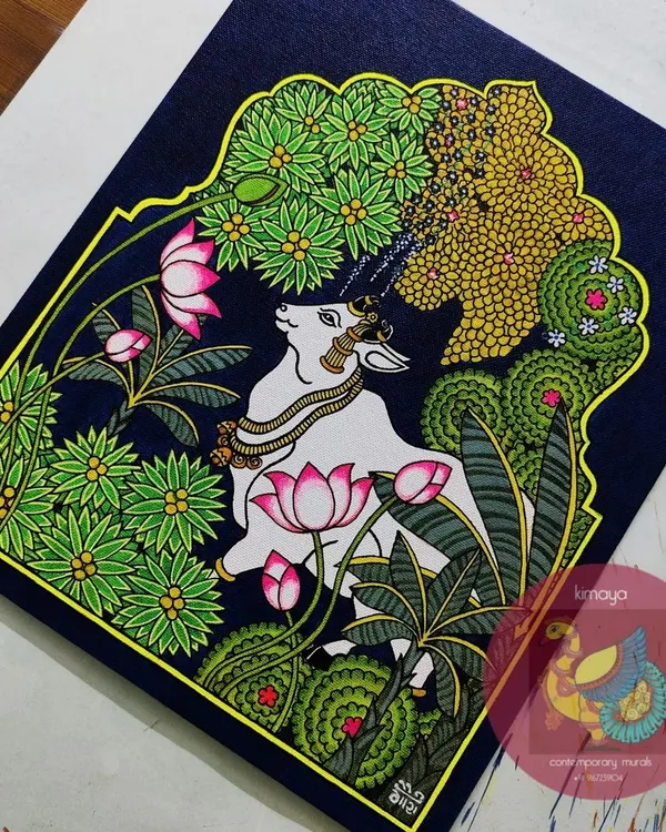 The final version of my Pichwai Cow painting, a showstopper piece for the year. This 12x14 inch artwork features a serene cow amidst a lush garden of lotuses and banana trees, set against a deep blue background, capturing the essence of Nathdwara.