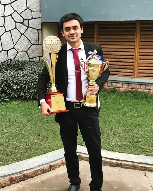This photo takes me back to my law school days. I once feared public speaking, but facing that fear led to winning these 'Winner' and 'Overall Champion' trophies in a moot court competition, shaping the confident advocate I am today.