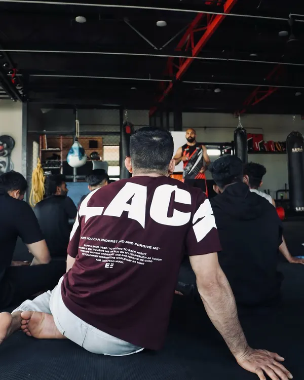 The seminar begins. We gather as a team to understand the fundamentals before we put them into practice. Everyone is here to learn and grow as a future MMA coach.