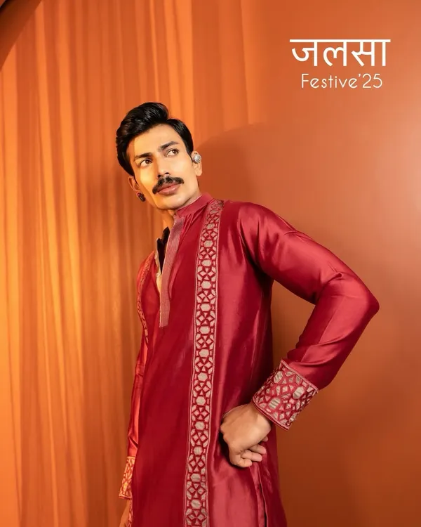 A striking shot from the Kaaj Button Studio 'Jalsa Festive' campaign. The grooming is clean and sharp, focusing on even skin tone and defining the model's strong features to suit the rich, festive attire.