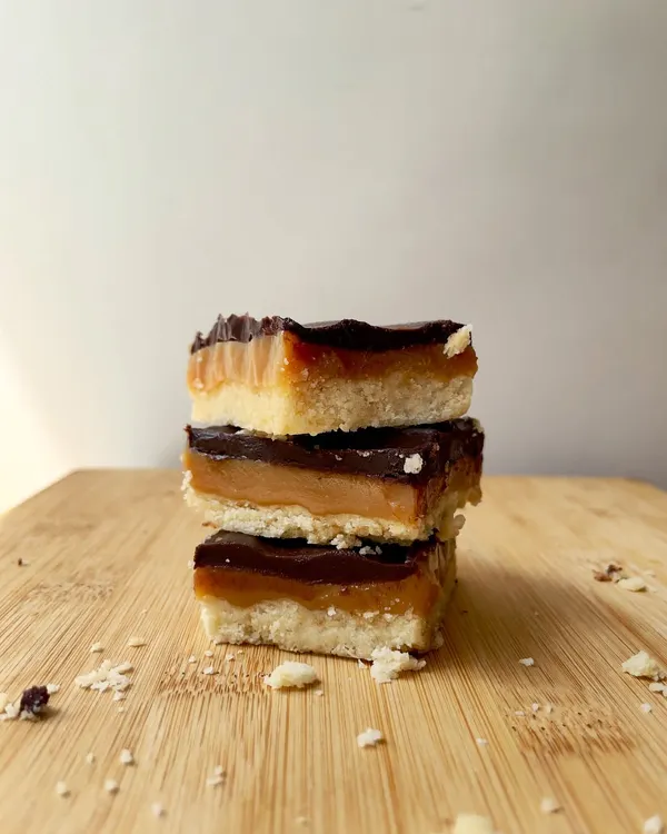 A stack of our delicious Regal Riches bars, a key component of our thoughtfully curated Rakhi indulgence hamper.