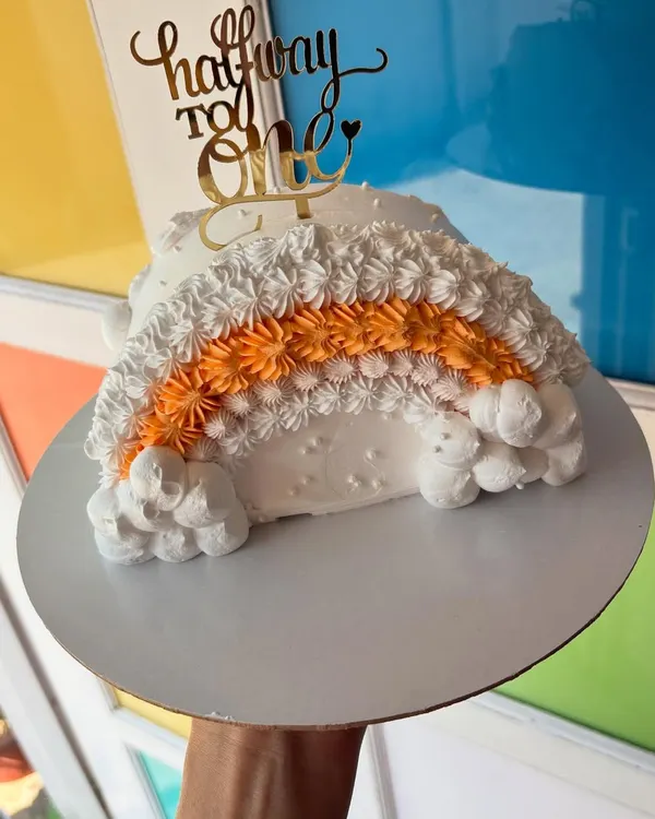 Halfway to one! Celebrating six sweet months with this adorable rainbow-shaped half-cake.