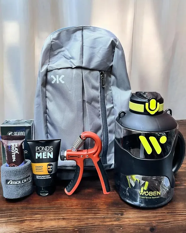A perfect gift for the fitness enthusiast in your life. This hamper includes a lightweight backpack, a large water bottle, a hand gripper, protein bars, and men's grooming essentials.