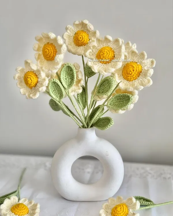 A full bouquet of my sweet crochet daisies arranged in a white vase. Their classic white and yellow look brings a fresh and simple charm to any room.