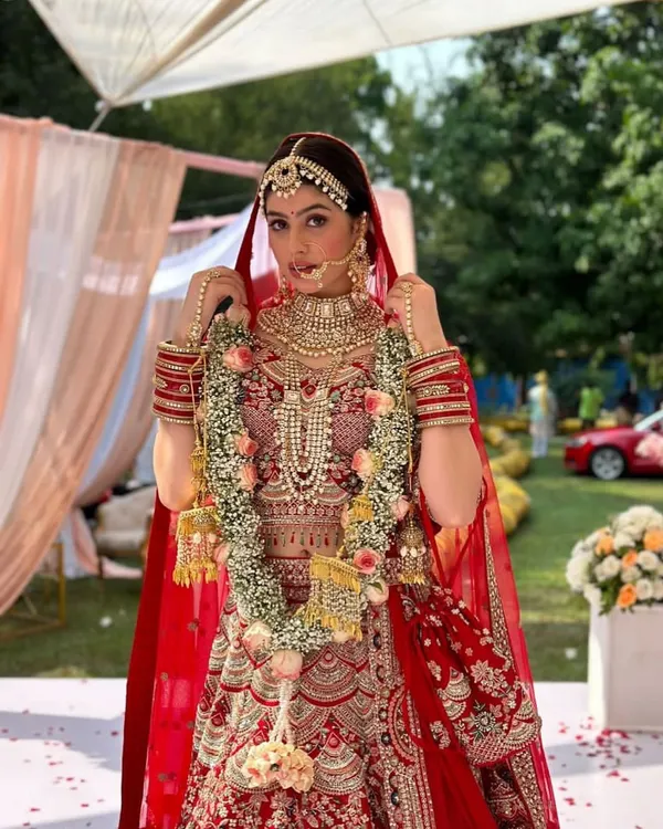 I styled this stunningly intricate Indian bridal look for a photoshoot with actress Riva Arora. The design features a heavily embroidered red lehenga, layered necklaces, a maang tikka, and a traditional red dupatta.