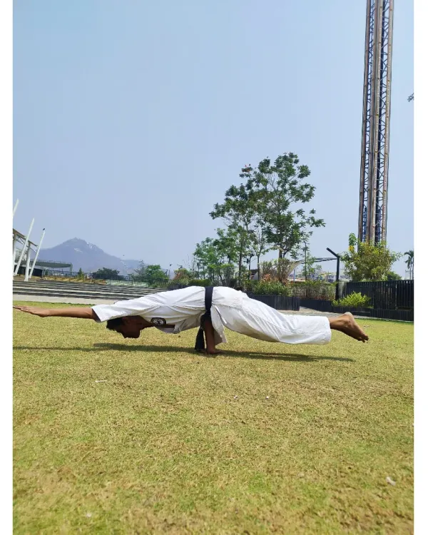 I believe karate builds not just a strong body, but a disciplined mind. This is a demonstration of the Mayurasana, or peacock pose, a difficult arm-balancing asana that requires immense core strength, focus, and control, all principles we cultivate in our training.