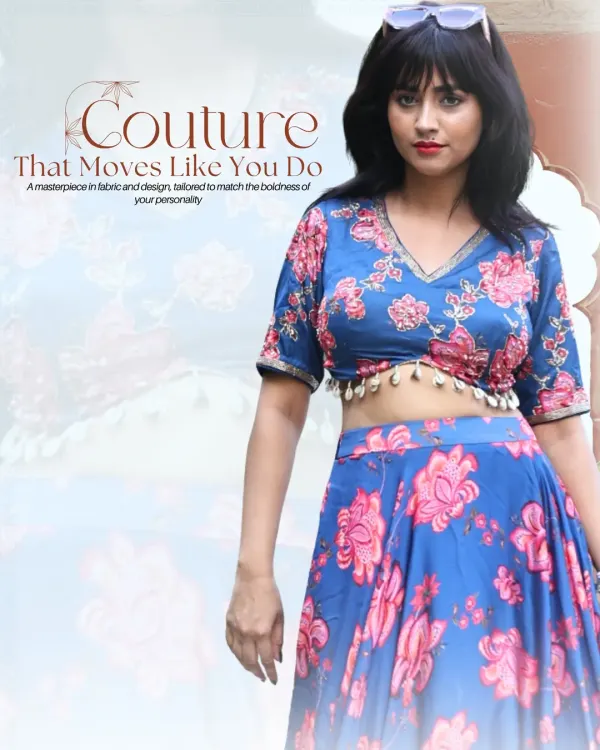 This vibrant blue lehenga with bold pink flowers is a favorite for mehendi functions. The V-neck blouse is accented with delicate shell tassels, and the flowing skirt is perfect for twirling.
