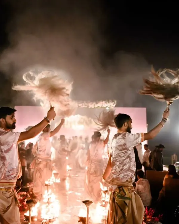 The sound of ringing prayer bells and chanting priests is a symphony to our ears. We recreated the divine energy of a Ganga Aarti for this wedding, with priests performing the ritual to bless the couple's union.
