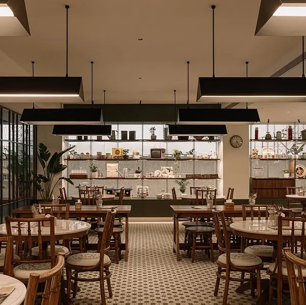 I designed the dining space to feel open, comfortable, and a bit old school, just like a traditional Kopitiam. The tiled floors, wooden furniture, and warm lighting are all meant to make you feel at home.