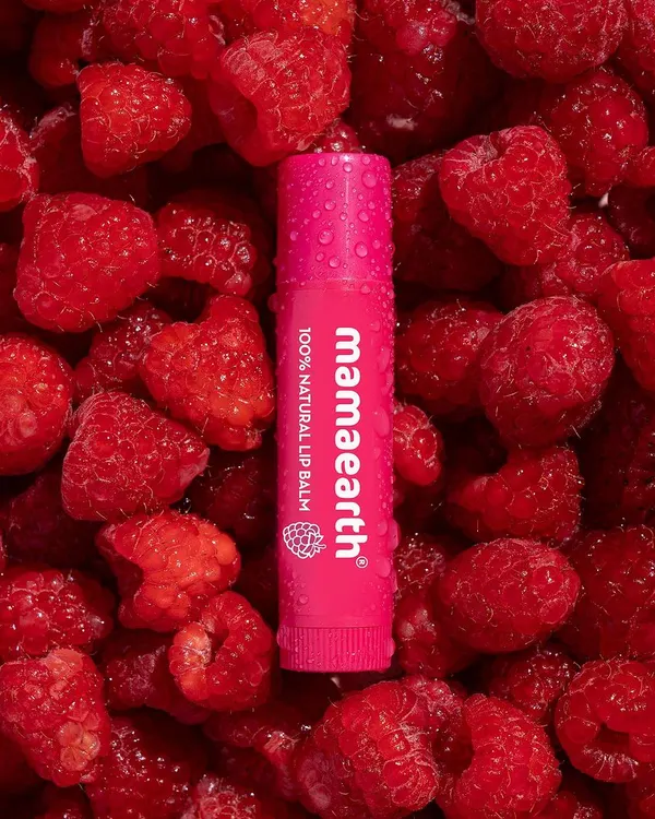 This shot for Mamaearth captures the essence of ingredient-focused beauty photography. The vibrant raspberries create a rich, textured background that makes the product pop, instantly communicating freshness and natural ingredients.
