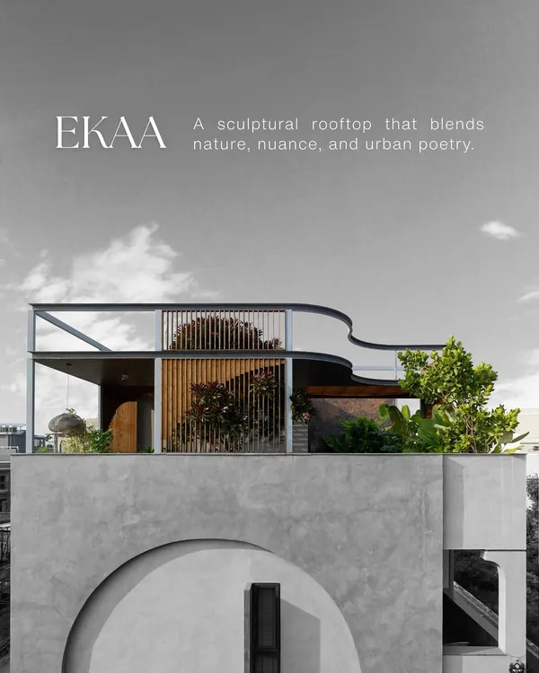 The sculptural rooftop of the EKAA project, where the landscape is designed to soften the architecture. Lush greenery and layered textures create a serene canopy that blends the building with the urban skyline.