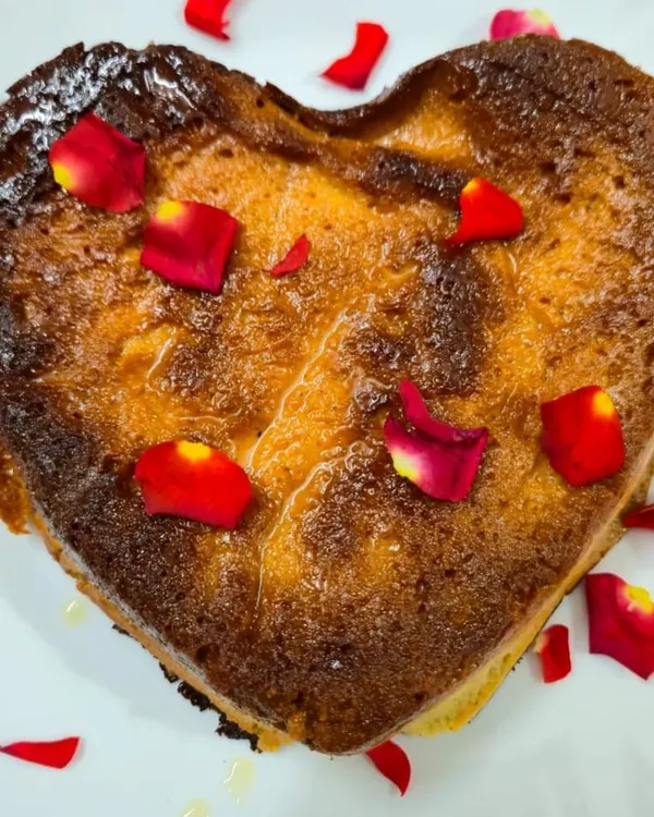 For special occasions, I offer this heart-shaped Chhenapoda, garnished with fresh rose petals. It’s the same authentic baked cheese dessert you love, presented in a way that’s perfect for anniversaries, birthdays, or just showing someone you care.