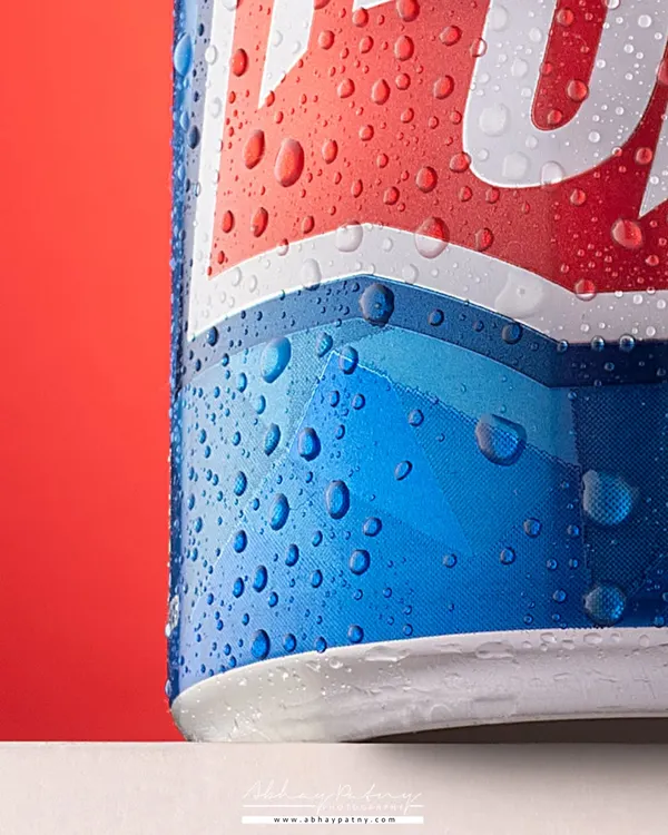 This is a close-up of the Thums Up can, focusing entirely on the technical perfection of the water droplets. This macro shot screams "ice-cold refreshment" and is a testament to detailed studio work.